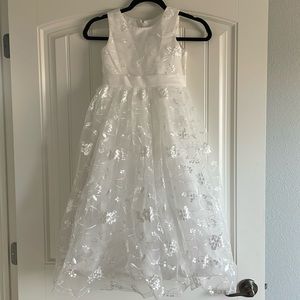 A beautiful Ivory lace dress for a young girl
